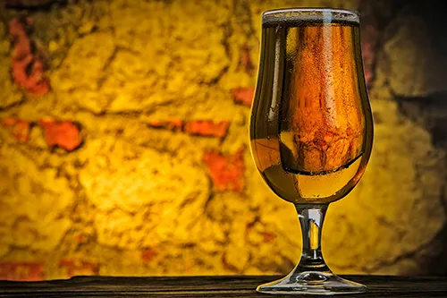 Beer set against a warm autumn wall
